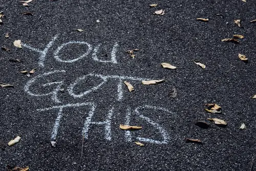 Chalk on a pavement saying "you got this"