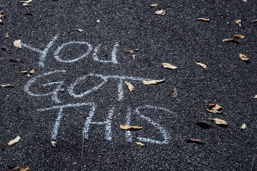 Chalk on a pavement saying "you got this"