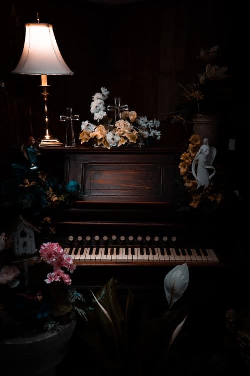 A piano covered in flowers