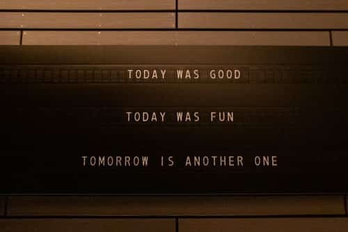 A message board that says "today was good, today was fun, tomorrow is another one"