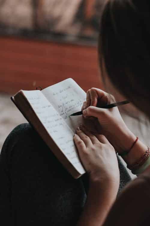 A girl writing in a journal