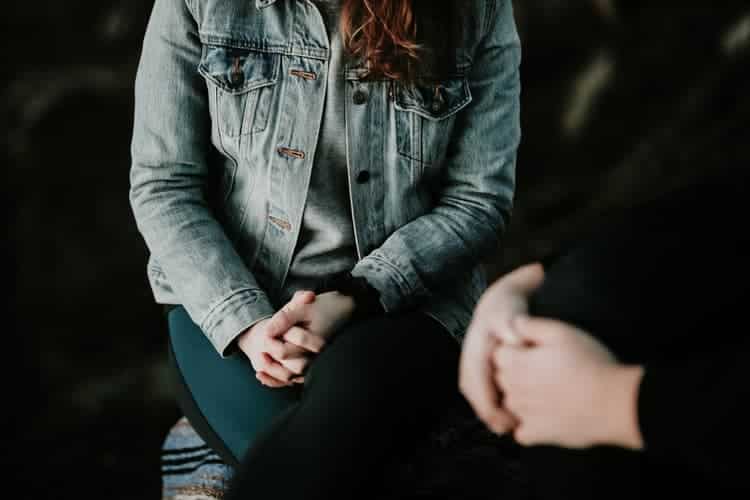 Two people sitting together